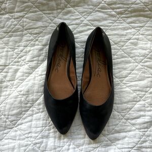 Black leather flats